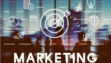 Marketing concept with target icon and analytics graphics displayed over a team meeting in a city office