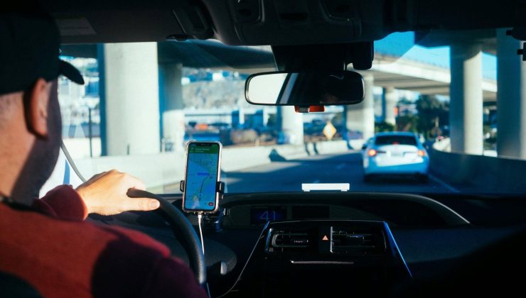 Driver navigating traffic while dealing with a defective vehicle issue under California Lemon Law